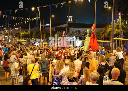 Annual festival of Medieval cultures of Europe. The procession of the column in the carnival historical costumes of the city at night. Cyprus, Ayia Stock Photo