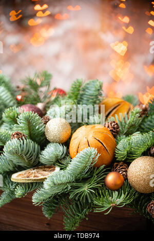 Stunning Orange Tree Arrangement with Cones and Nuts