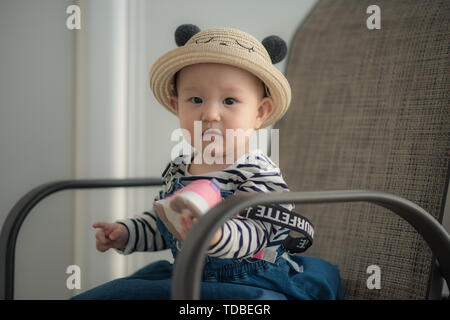 Nine-month-old toddler takes photo on cruise ship trip Stock Photo