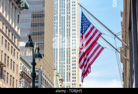 USA symbol in New York streets. American flags on a classical building, Manhattan downtown, business area Stock Photo