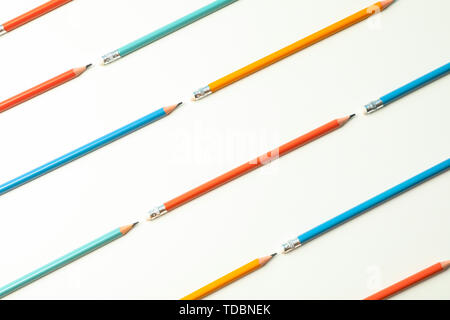 Flat lay composition with pencils on white background, space for text Stock Photo