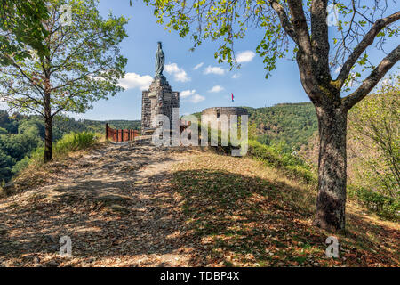 Ardennes hill with memorial statue near Village Esch-sur-Sure in Luxembourg Stock Photo