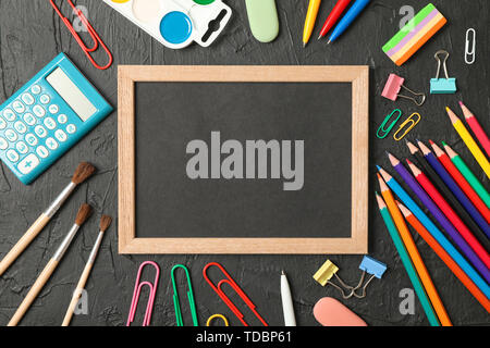 Composition with school supplies on black background, space for text Stock Photo