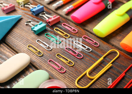Flat lay composition with school supplies on wooden background Stock Photo
