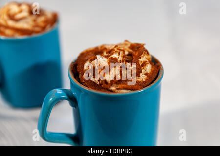 09 Jun 2019 Hot chocolate with whipped cream and a dusting of cocoa powder Stock Photo