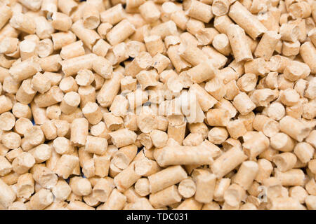 granular animal litter covers the bottom of the container Stock Photo