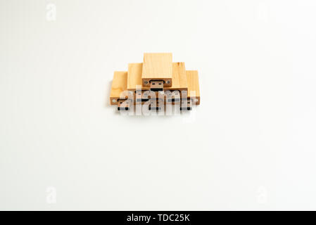 Stack of wooden pendrive memory usb isolated on white background. Stock Photo