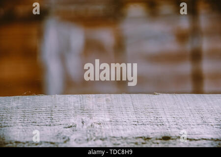 Blurred background of warehouse workshop or building site. Table scratched table top. Copy space. Bricks background blurred Stock Photo