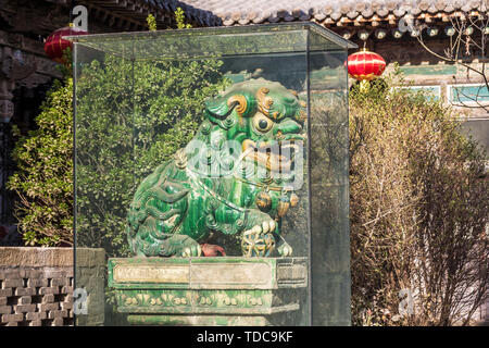 The green glazed pottery lion of the Ming Dynasty in the boundless temple in Taigu, Shanxi, is also a glazed lion. Stock Photo