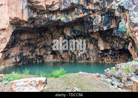 The Grotto of the God Pan 3rd Century BCE filled with water ,Hermon Stream Nature reserve and Archaeological Park ,Banias, Golan Heights Israel Stock Photo