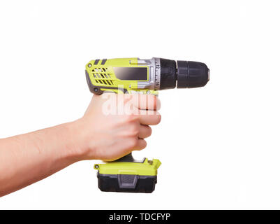 Male hand holding a cordless yellow screwdriver. Hand isolated on white background Stock Photo