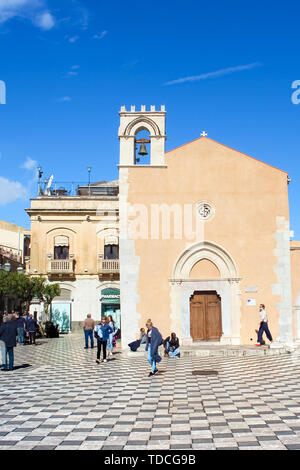 Taormina, Sicily, Italy - Apr 8th 2019: People on the Piazza IX Aprile Square in beautiful historical center of the Italian city. Famous tourist spot. Travel destination, sightseeing. Stock Photo