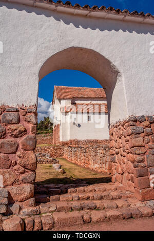 View on the small rustic town of Chinchero in Sacred Valley near the Cusco city in Peru. Incan ruins and colonial church with characteristic arches. Stock Photo