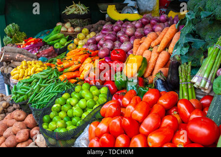 Colorful display of the variety fruits and vegetables on the market stand in Lima, Peru. Stock Photo