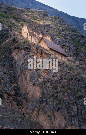 Storehouses (Pinkuylluna) build on the cliff of Ollantaytambo - Incan ruins, archaeological site in Sacred Valley. Stock Photo