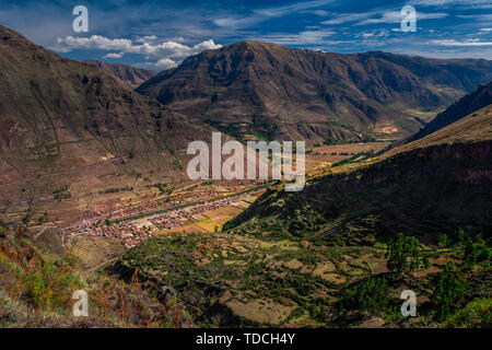 Spectacular view on the Sacred Valley near by the Cusco / Cuzco city in Peru. Enormous Andes mountains and the small villages in the canyon. Stock Photo