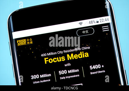 Berdyansk, Ukraine - 10 June 2019: Focus Media website homepage. Focus Media logo visible on the phone screen. Stock Photo