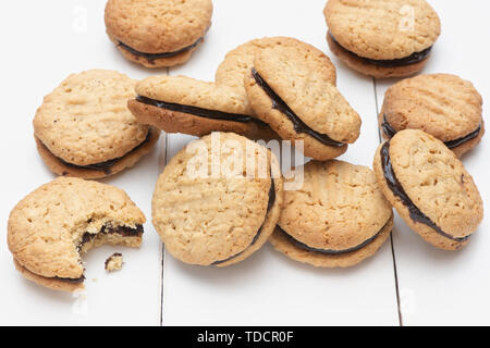 Homemade kingston biscuits. Australian biscuit. Round coconut and oat biscuits with chocolate cream in the middle Stock Photo