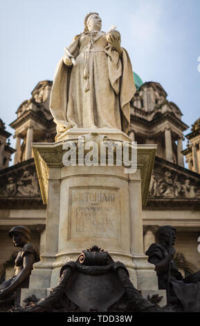 BELFAST, UK - 8TH APRIL 2019: Statue of the British Queen Victoria in front of Belfast City Hall, Donegall Square, Northern Ireland Stock Photo