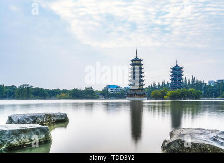 Morning Sun and Moon Twin Towers Park in Guilin, Guangxi, China Stock Photo