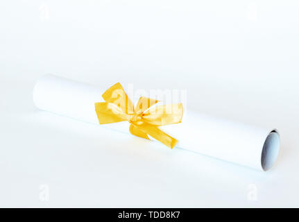 Certificate diploma with golden ribbon isolated on white background. Stock Photo