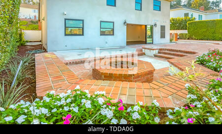 House With A Stone Brick Patio And Octagonal Fire Pit Made Of The