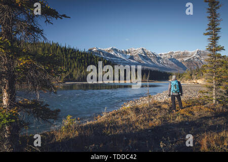 Man in the Canadian Wilderness, North Saskatchewan River, Kootenay Plains, Alberta, Canada Stock Photo