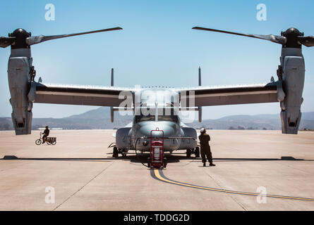 An MV-22B Osprey with Marine Medium Tiltrotor Squadron (VMM) 764, 4th Marine Aircraft Wing, waits on the flight line before taking off from Marine Corps Air Station Miramar, Calif., June 12. Once a year reserve components of the Marine Corps go on two-week annual training detachments to sharpen their skills in their military occupational specialties. (U.S. Marine Corps photo by Sgt. Becky Cleveland) Stock Photo