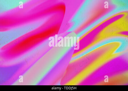 Abstract neon colorful fluid art on concrete background. Digital modern art. Flowing green, pink, blue, orange and purple colors. Stock Photo