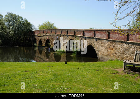 The bridge at Great Barford, Bedfordshire, dates partly to the 15th century.  It has 17 arches spanning the River Ouse.  Sir Gerard Braybrooke, who di Stock Photo