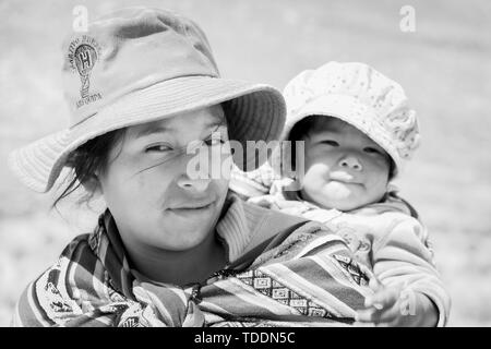 Portrait of a Quechua woman with a baby in the Reserva Nacional de Salinas y Aguada Blanca, Arequipa, Peru, Stock Photo