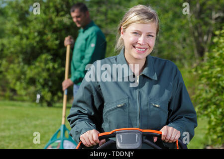 smiling blond woman gardening Stock Photo