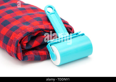 Sticky washable roller for cleaning clothes from animal hair and the pellet. Cleaning clothes and furniture from dust, wool, hair Stock Photo
