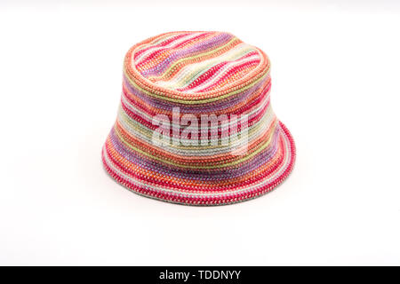 Colorful knitted hat on a white background. Handwork. Fashion concept for men, women and children. Stock Photo
