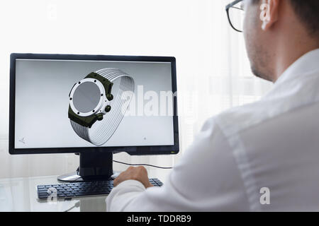 LOS ANGELES, CALIFORNIA - JUNE 3, 2019: Engineer, Constructor, Designer, Architect in Glasses Working on a Personal Computer. He Creating New Design o Stock Photo
