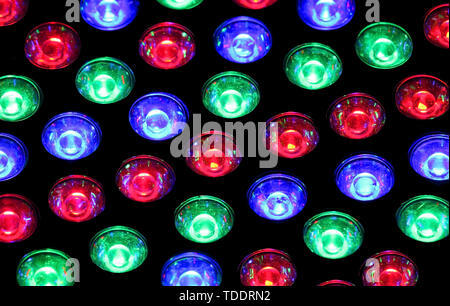 background of many red blue and green lights in a disco night club Stock Photo