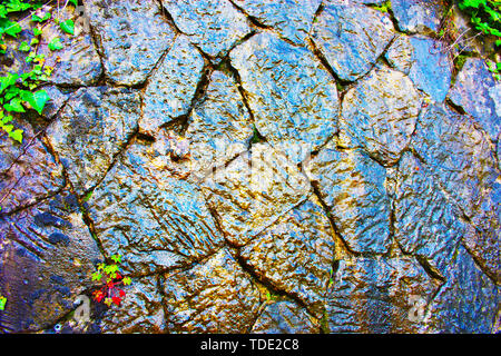 abstract texture background. marble, stone or dark stone wet look. jugla, forest or monument. wet structure, ancient construction Stock Photo