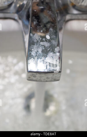 Running faucet splashing water in dirty grimey gross nasty disgusting wash sink. Bathroom Kitchen sink faucet running water splash. Clogged wet water  Stock Photo