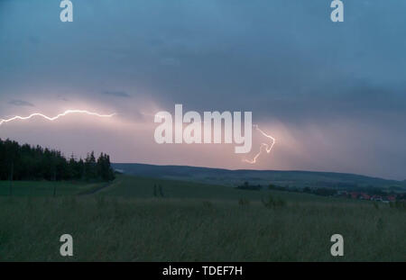 Deister, Germany. 15th June, 2019. The still image from a video shows a thunderstorm with lightnings over the Deister. A thunderstorm with heavy rain and hail had struck Hannover and the Weserbergland in the night to Saturday. (ATTENTION: Best available technical quality) Credit: TNN/dpa/Alamy Live News Stock Photo