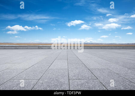 Empty marble floor with snow mountains Stock Photo