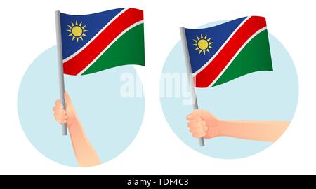 Namibia flag in hand. Patriotic background. National flag of Namibia  illustration Stock Photo