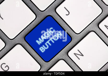 Blue Magic button on computer gray keyboard Stock Photo