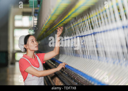 A woman in a textile factory. Stock Photo