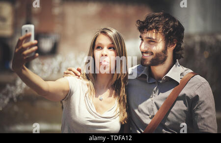 Couple of turists taking a selfie in the city Stock Photo