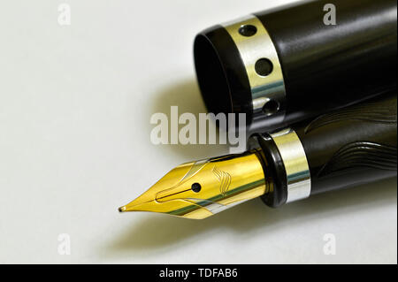 Tip of the fountain pen on white background. Stock Photo