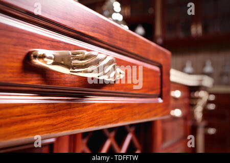 wooden cupboard with opened empty drawer Stock Photo