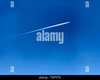 A flying plane, close-up. Stock Photo