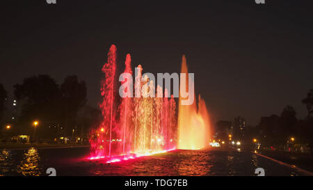 red lighting on the magic water circuit fountain in lima, peru Stock Photo