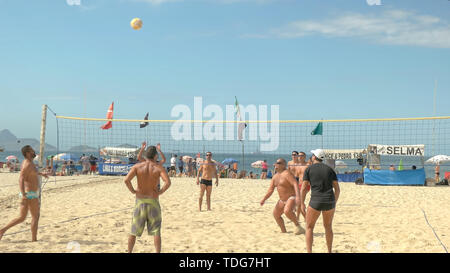 RIO DE JANEIRO, BRAZIL- 26, MAY, 2016: shot of a point being played in a volleyball game on copacabana beach in rio de janeiro, brazil Stock Photo