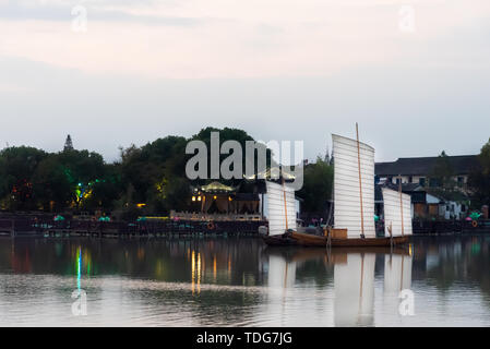 A sailboat on the surface of South Lake in the ancient town of Zhouzhuang Stock Photo
